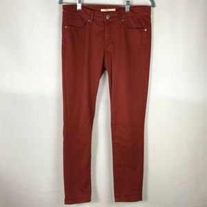 Levi 711 Skinny Jean Size 28 in Rust Color.